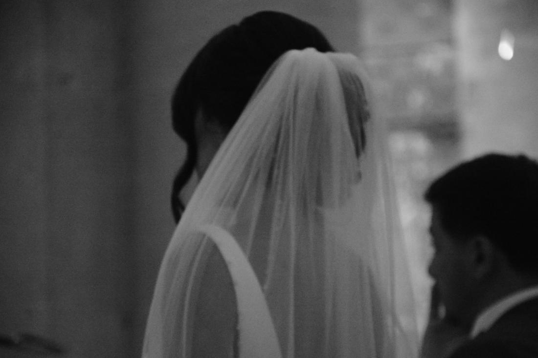 Bridal veil in a sacred place, a suspended wedding moment in black and white